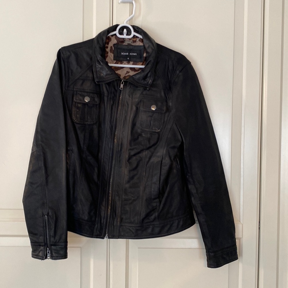 Black Rivet women’s genuine, leather coat, size, XL  with cheetah lining.